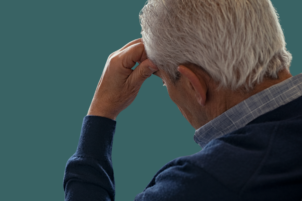 Ein mann med handa over ansiktet