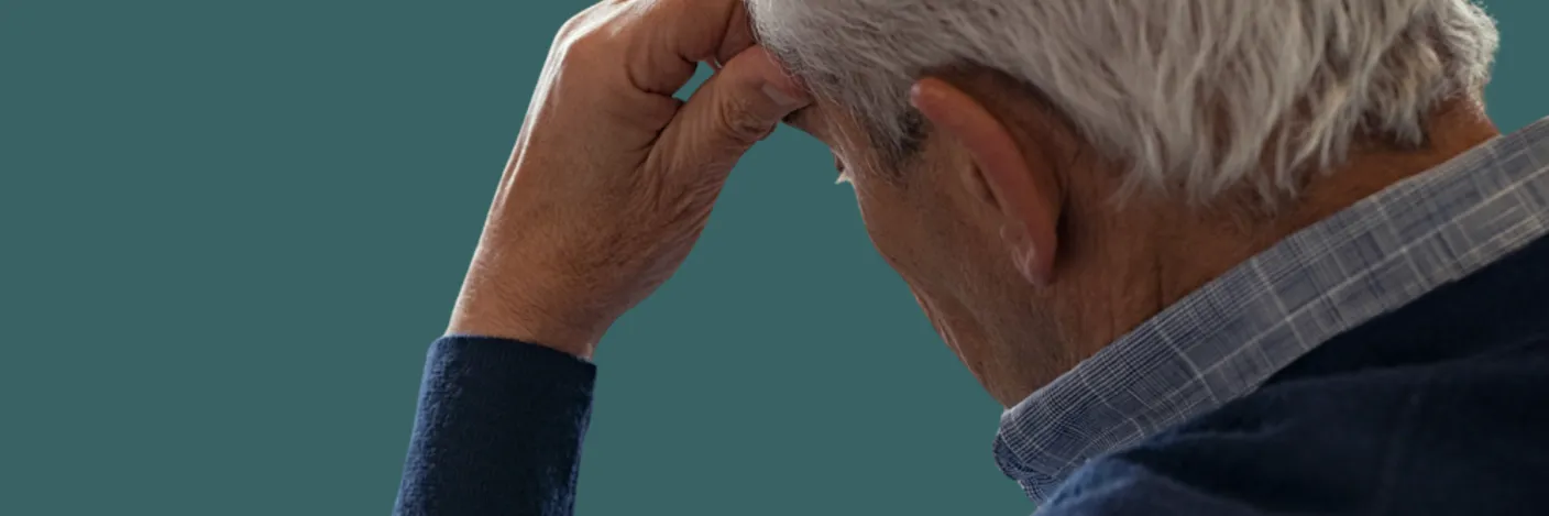 Ein mann med handa over ansiktet