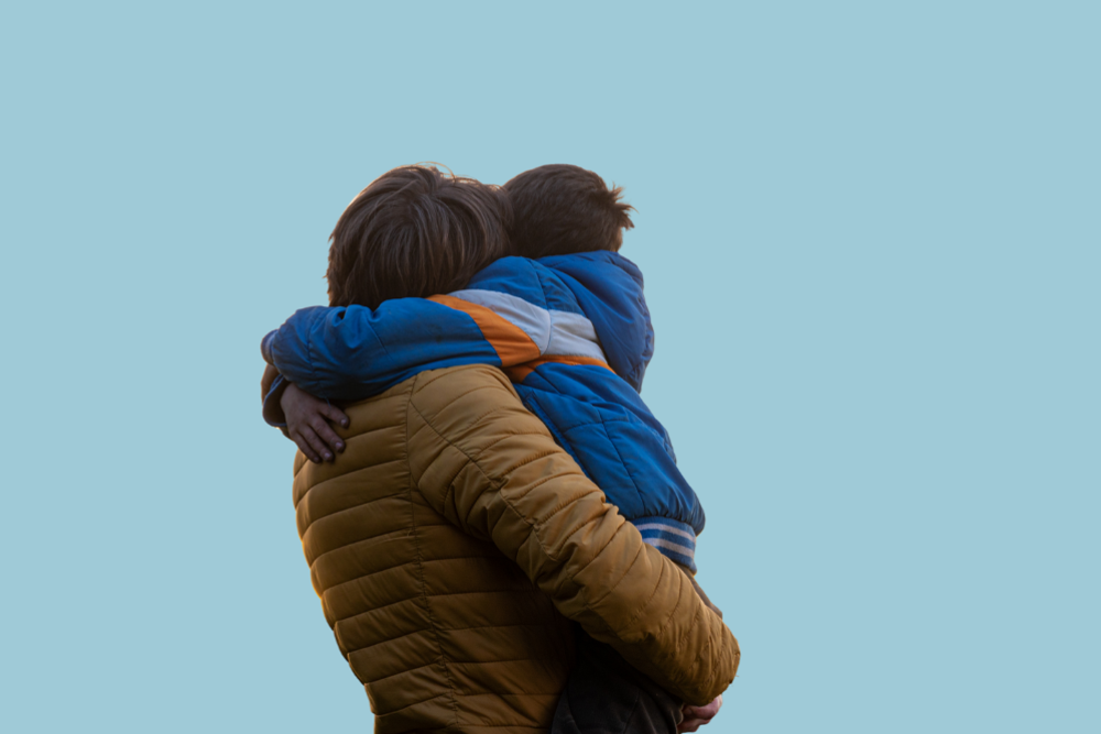 Ein person som bærer eit barn