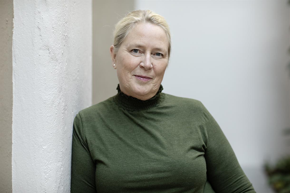 En person i en grønn genser